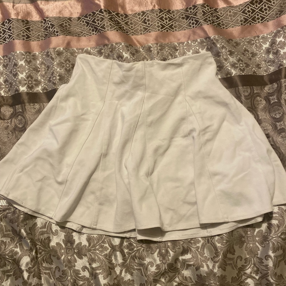 A white knee high skirt.